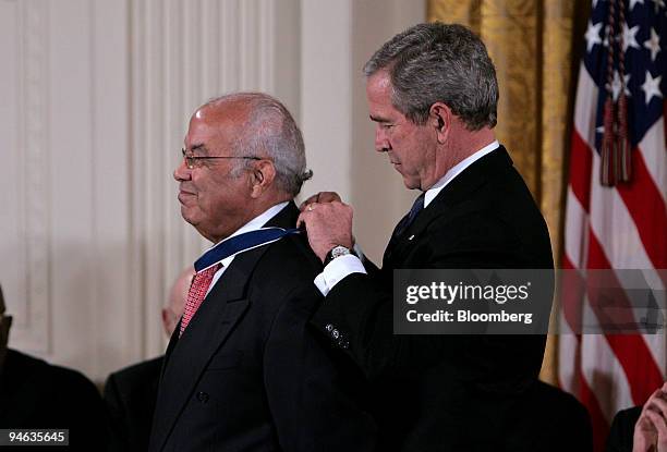 President George W. Bush, right, presents the Presidential Medal of Freedom to Norman C. Francis in the East Room of the White House in Washington,...