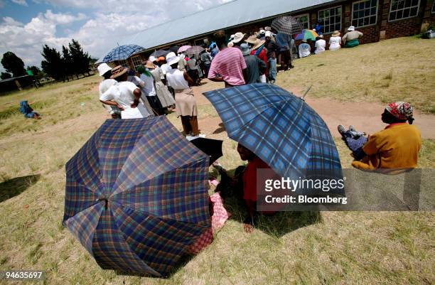 People wait to cast their ballots at a voting station outside Maseru, Lesotho, on Saturday, Feb. 17, 2007. Voters in the southern African kingdom of...