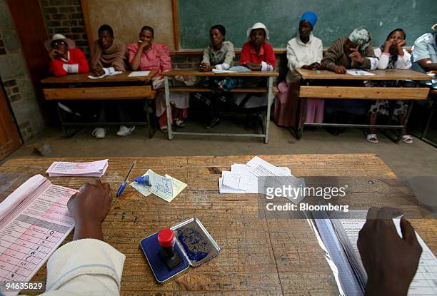 Party agents watch over the voting procedures in Maseru, Lesotho, on Saturday, Feb. 17, 2007. Voters in the southern African kingdom of Lesotho...