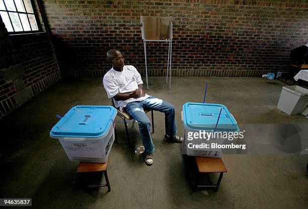 An electoral officer supervises the ballot proceedings at a voting station outside Maseru, Lesotho, on Saturday, Feb. 17, 2007. Voters in the...