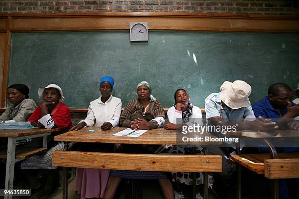Party agents watch over the voting procedures in Maseru, Lesotho, on Saturday, Feb. 17, 2007. Voters in the southern African kingdom of Lesotho...