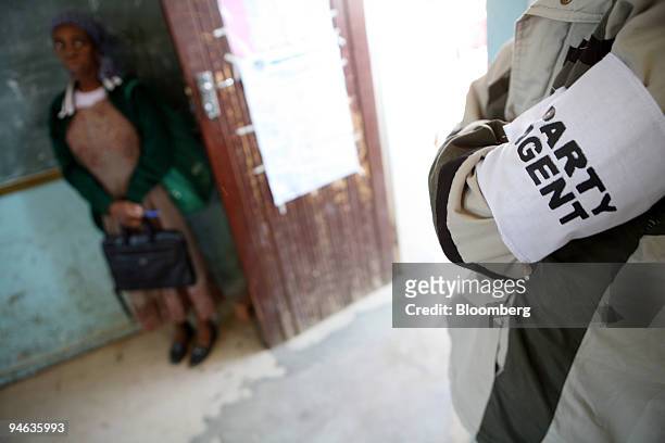 Party agent observes the voting proceedings at a voting station in Maseru, Lesotho, on Saturday, Feb. 17, 2007. Voters in the southern African...