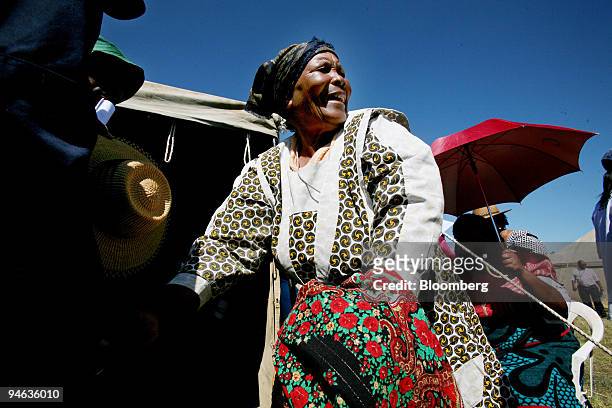An elderly woman goes into a voting station to cast her vote near Maseru, Lesotho, on Saturday, Feb. 17, 2007. Voters in the southern African kingdom...