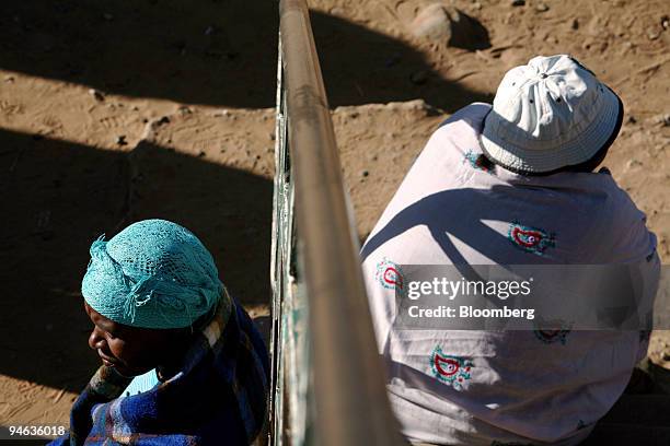 People wait in line to cast their ballots in Maseru, Lesotho, on Saturday, Feb. 17, 2007. Voters in the southern African kingdom began queuing at...