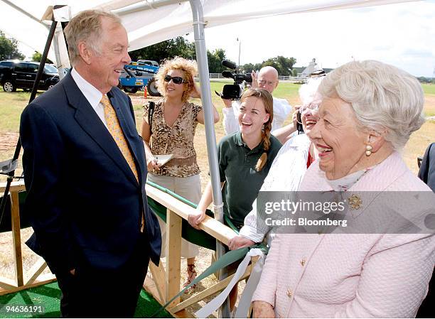 Boone Pickens, left, speaks with Dallas businesswoman Ebby Halliday, right, along with students and guests of Happy Hills Farm Academy/House in...