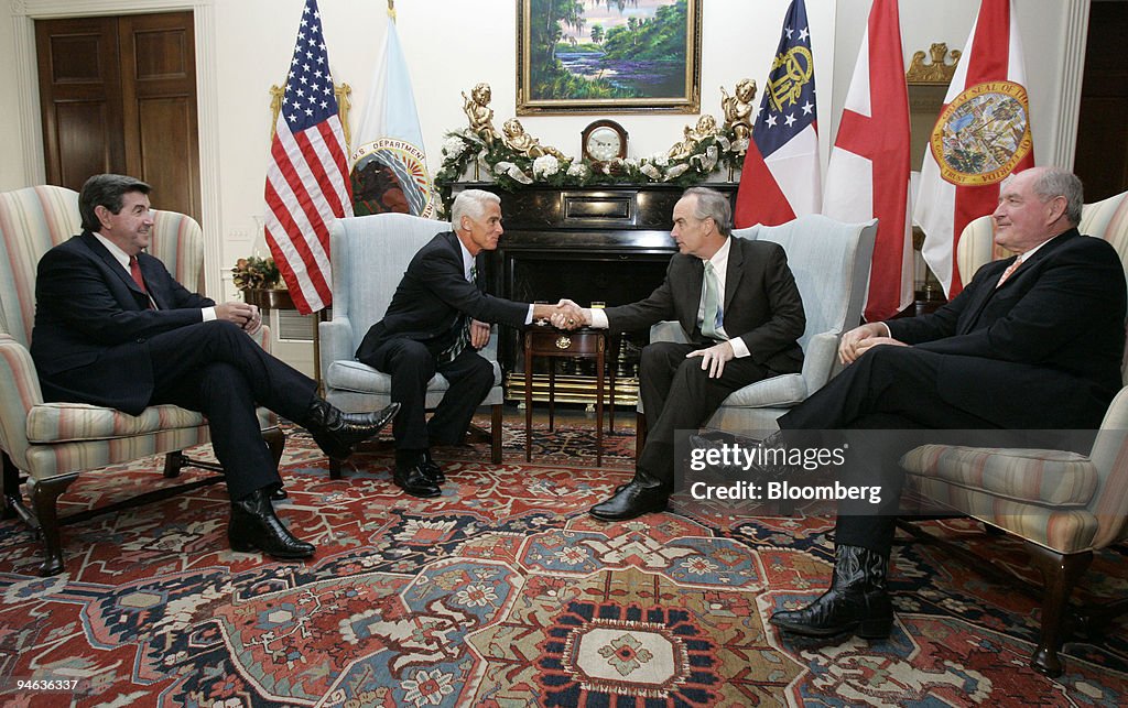 Governor Charlie Crist, a Florida Republican, second from le