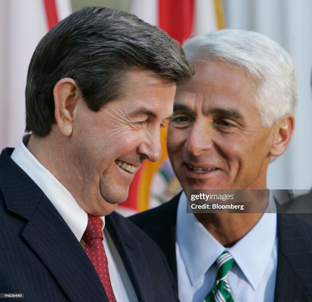 Robert "Bob" Riley, governor of Alabama, left, speaks with w