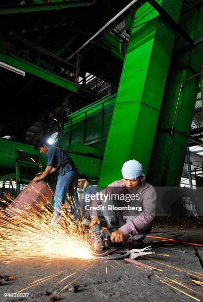 Worker grinds a peace of steel to repairer at a facility in Ao Luek, Krabi province, southern Thailand on Saturday, June 9, 2007. The facility...