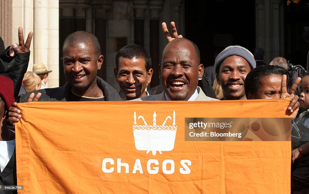 Oliver Bancoult, center right, celebrates with other Chagos