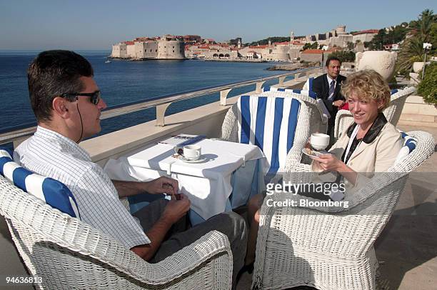 Guests enjoy coffee and a luxurious view of the Mediterranean on the sun deck of the Hotel Excelsior in Dubrovnik, Croatia, on Saturday, October 7,...
