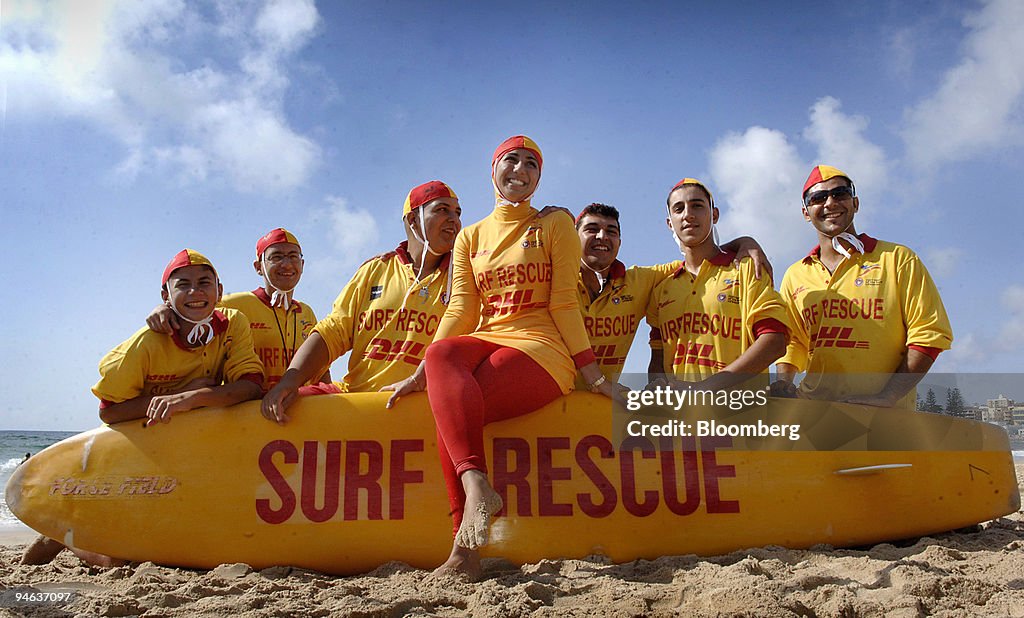 Mecca Laalaa, a Surf Life Saver volunteer lifeguard, center,