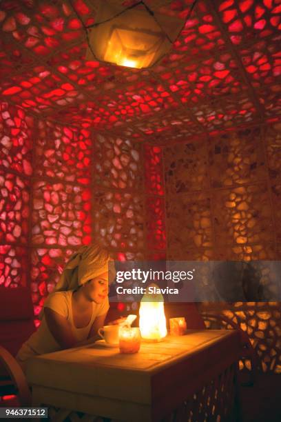 beautiful woman in the salt room - spa treatment stock pictures, royalty-free photos & images