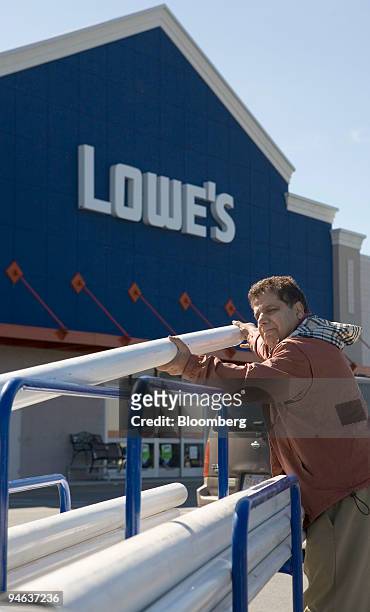 Reza Jahedi unloads polyvinyl chloride pipe he purchased at the Lowe's store in Dedham Massachusetts Monday, May 22, 2006. Lowe's Cos., the...