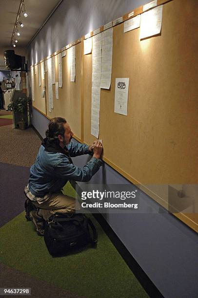 James Hartman writes information from a job posting at one of the Denver Workforce Centers in Denver, Colorado Thursday, December 14, 2006. Fewer...