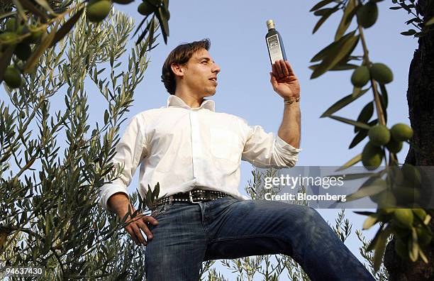 Di Bennardo, maker of Di Bennardo L'Olio d'Oliva, owner Giovanni Di Bennardo poses with a bottle of his company's olive oil in one of his family's...