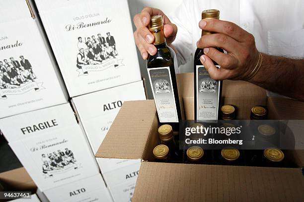 Di Bennardo, maker of Di Bennardo L'Olio d'Oliva, owner Giovanni Di Bennardo packs bottles of his company's olive oil at their estate in Sambuca di...