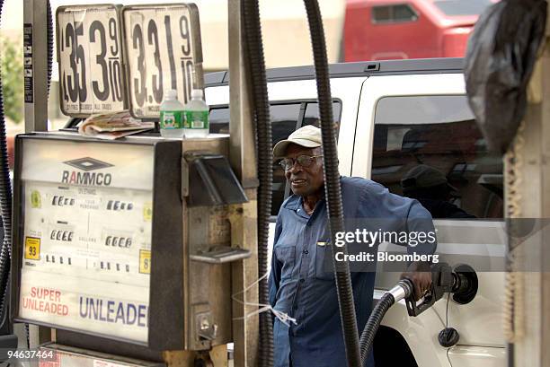 Joseph Smith, a gas attendant at the Rammco Station on Broadway and 182nd street fills up an SUV with supreme gas at $3.53 a gallon in Manhattan, NY,...