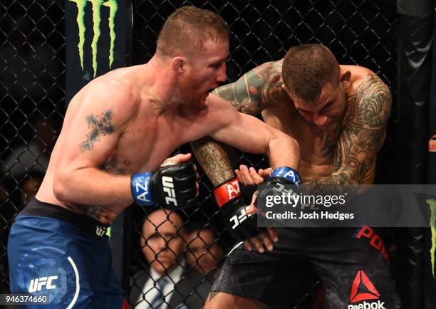 Justin Gaethje punches Dustin Poirier in their lightweight fight during the UFC Fight Night event at the Gila Rivera Arena on April 14, 2018 in...