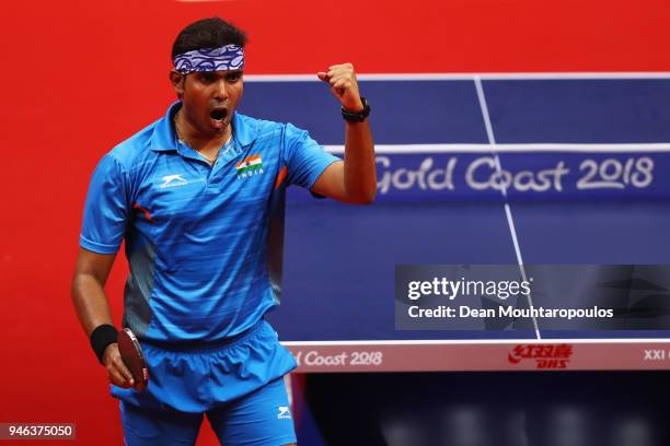 Sharath Achanta of India celebrates a point during Table Tennis Men's Singles Bronze Medal match between Sharath Achanta of India and Samuel Walker...