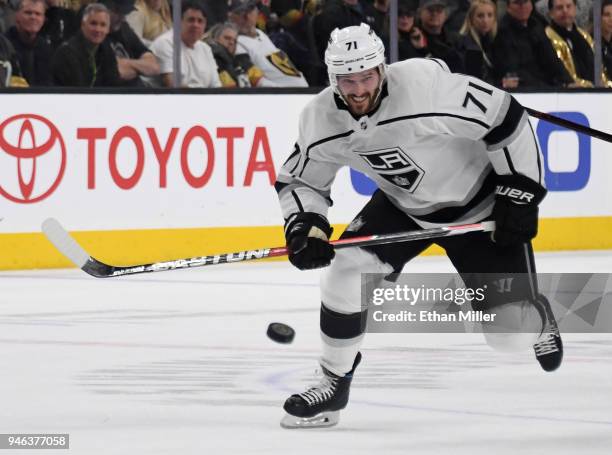 Torrey Mitchell of the Los Angeles Kings sends the puck up the ice against the Vegas Golden Knights in the third period of Game Two of the Western...