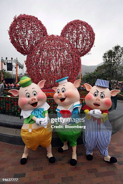 Disney's Three Little Pigs pose in front of a cherry blossom Mickey Mouse at Hong Kong Disneyland on Thursday, Feb. 15 in Hong Kong, China. The Year...