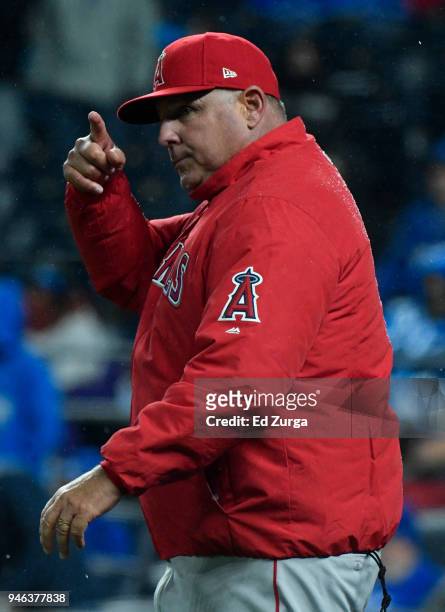 Mike Scioscia manager of the Los Angeles Angels of Anaheim signals for a pitching change in the seventh inning against the Kansas City Royals at...