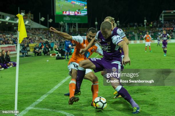 Fahid Ben Khalfallah tackles Shane Lowry of the Glory at Glorys corner at nib Stadium on April 14, 2018 in Perth, Australia.