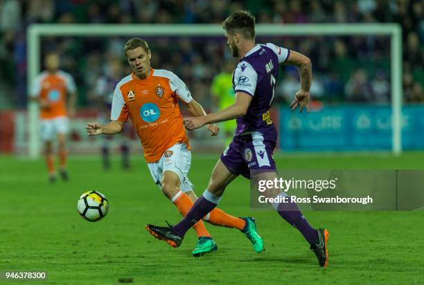 Thomas Kristensen of the Roar tackles Alex Grant of the Glory at nib Stadium on April 14, 2018 in Perth, Australia.