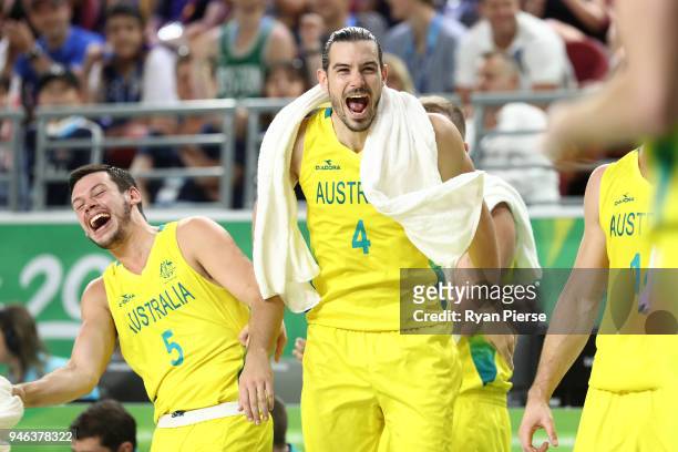 Australia guard Jason Cadee and Australia guard/forward Chris Goulding celebrate during the Men's Gold Medal Basketball Game between Australia and...