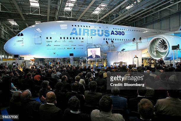 News conference is held in front of an Airbus A380 plane following the certification of the A380 in Colomiers, France, Tuesday, December 12, 2006....
