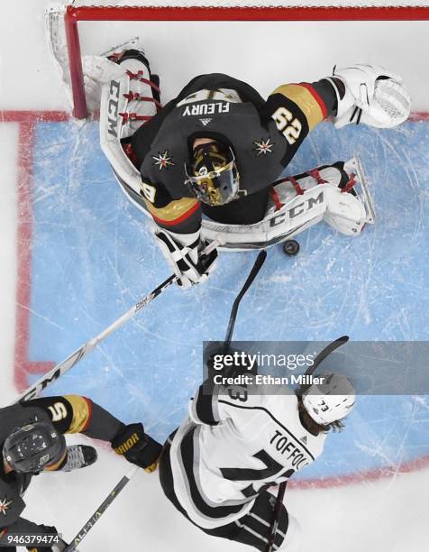 Marc-Andre Fleury of the Vegas Golden Knights blocks a shot by Tyler Toffoli of the Los Angeles Kings as Deryk Engelland of the Golden Knights...