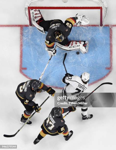 Marc-Andre Fleury of the Vegas Golden Knights blocks a shot by Tyler Toffoli of the Los Angeles Kings as Deryk Engelland and Shea Theodore of the...