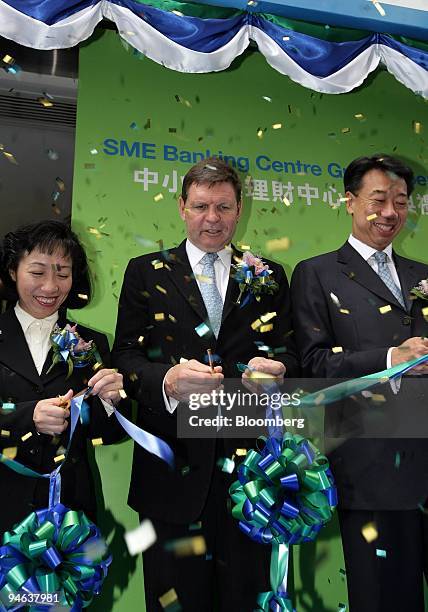 Standard Chartered Bank executives, Betty Ku, general manager for SME banking, Peter Sullivan, chief executive officer of Hong Kong and Benjamin...