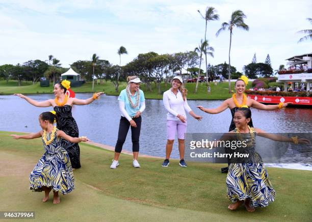 Brooke Henderson of Canada, and her caddie and sister Brittany Henderson, participate in a hula at the victory ceremony after winning the LPGA LOTTE...