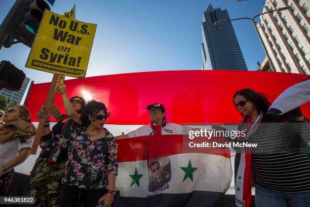 Supporters of Syrian president Bashar al-Assad protest the U.S.-led coalition attack in Syria, on April 14, 2018 in Los Angeles, California. Air...