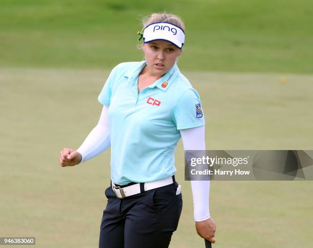 Brooke Henderson of Canada celebrates her birdie putt on the 16th green, on her way to a four shot victory to win the LPGA LOTTE Championship at the...