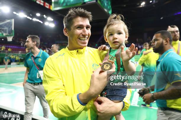 Australia guard Damian Martin celebrates winning gold during the medal ceremony for the Men's Gold Medal Basketball Game between Australia and Canada...