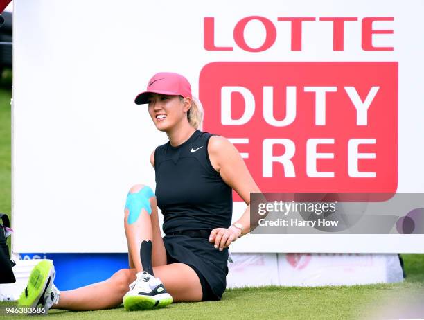 Michelle Wie stretches on the 18th tee box during the fourth round of the LPGA LOTTE Championship at the Ko Olina Golf Club on April 14, 2018 in...