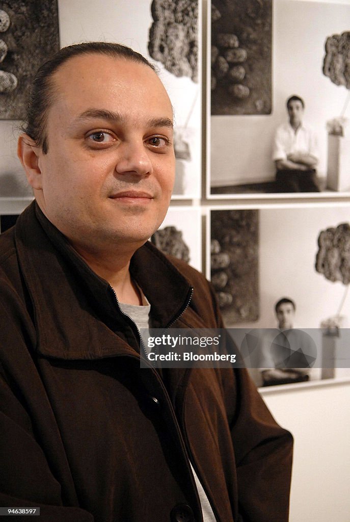Yves Amu Klein, Yves Klein son, poses near pictures of his f