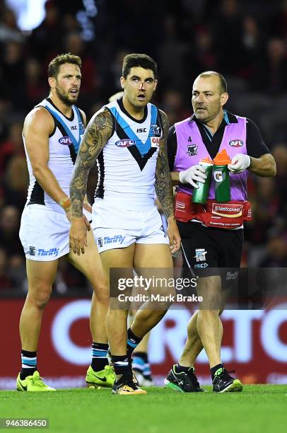 Chad Wingard of Port Adelaide leaves the grounfd with a blood nose during the round four AFL match between the Essendon Bombers and the Port Adelaide...