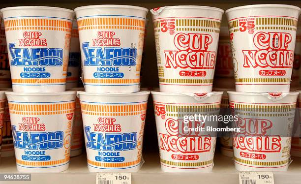 Cup noodles made by Nissin Food Products Co. Sit on a shelf at a store in Tokyo, Japan, on Wednesday, December 13, 2006. Nissin Food, Japan's top...