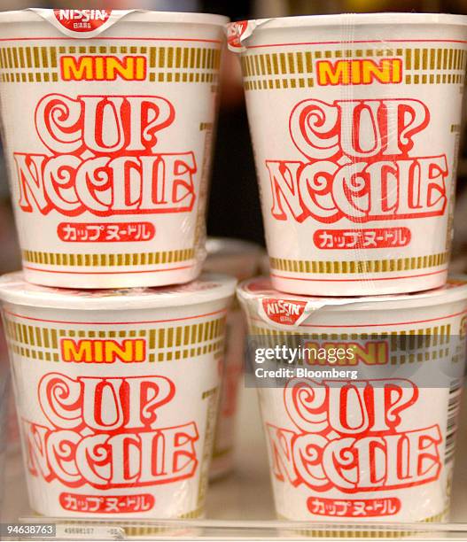 Cup noodles made by Nissin Food Products Co. Sit on a shelf at a store in Tokyo, Japan, on Wednesday, December 13, 2006. Nissin Food, Japan's top...