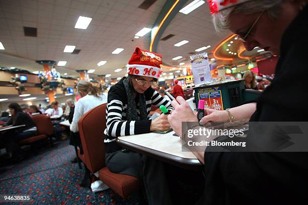 Women play bingo at Beacon Bingo, in Cricklewood Broadway north London, on Wednesday, December 13, 2006. Bingo parlors, once the realm of retirees...