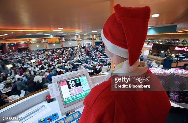 Bingo caller calls numbers at Beacon Bingo in Cricklewood Broadway, north London, on Wednesday, December 13, 2006. Bingo parlors, once the realm of...