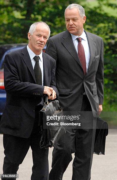 Lukas Muehlemann, right, the former chairman of Credit Suisse Group and member of Swissair's board, arrives with his lawyer at the Swissair trial in...