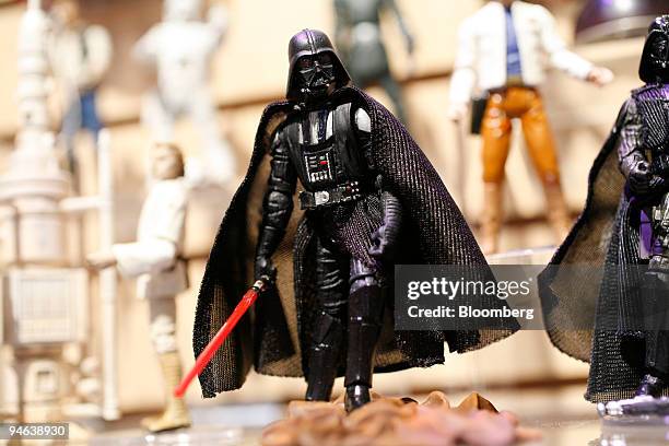 Darth Vader stands amongst other Star-Wars figures on display in the Hasbro showroom during the International Toy Fair, Monday, Feb. 12, 2007 in New...