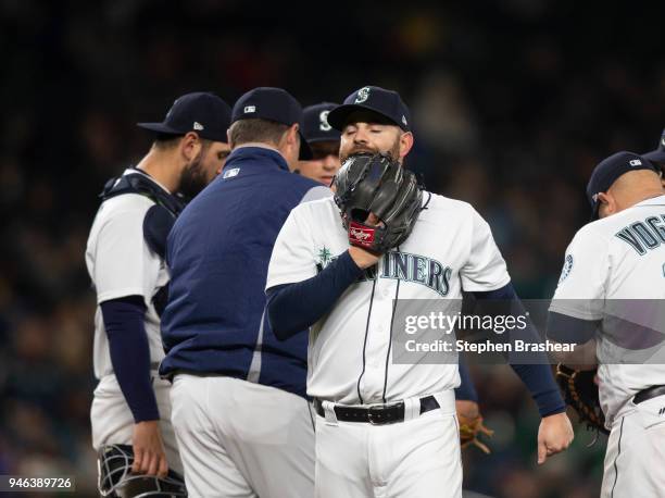 Relief pitcher Marc Rzepczynski of the Seattle Mariners reacts after being pulled from the game by manager Scott Servais during the seventh inning...