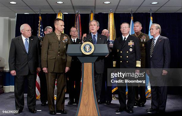 President George W. Bush makes a statement after meeting with military advisors at the Pentagon, December 13, 2006 in Arlington, Virginia. Gathered...