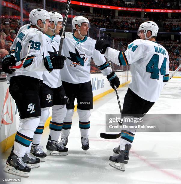 Logan Couture, Tomas Hertl, Melker Karlsson, and Marc-Edouard Vlasic of the San Jose Sharks celebrate Hertl's second period goal against the Anaheim...