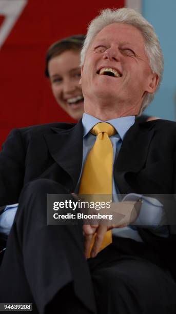 Former President Bill Clinton haves a laugh during Class day exercises at Harvard University in Cambridge, Massachusetts on June 6, 2007.